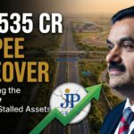 Editorial graphic thumbnail illustrating Gautam Adani’s acquisition of Jaiprakash Associates, featuring the Yamuna Expressway and Sports City background.