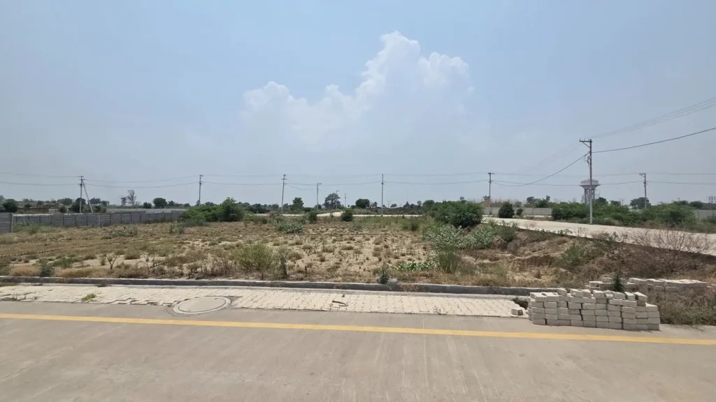 Corner industrial land plot in Baghpat with internal road access and surrounding infrastructure
