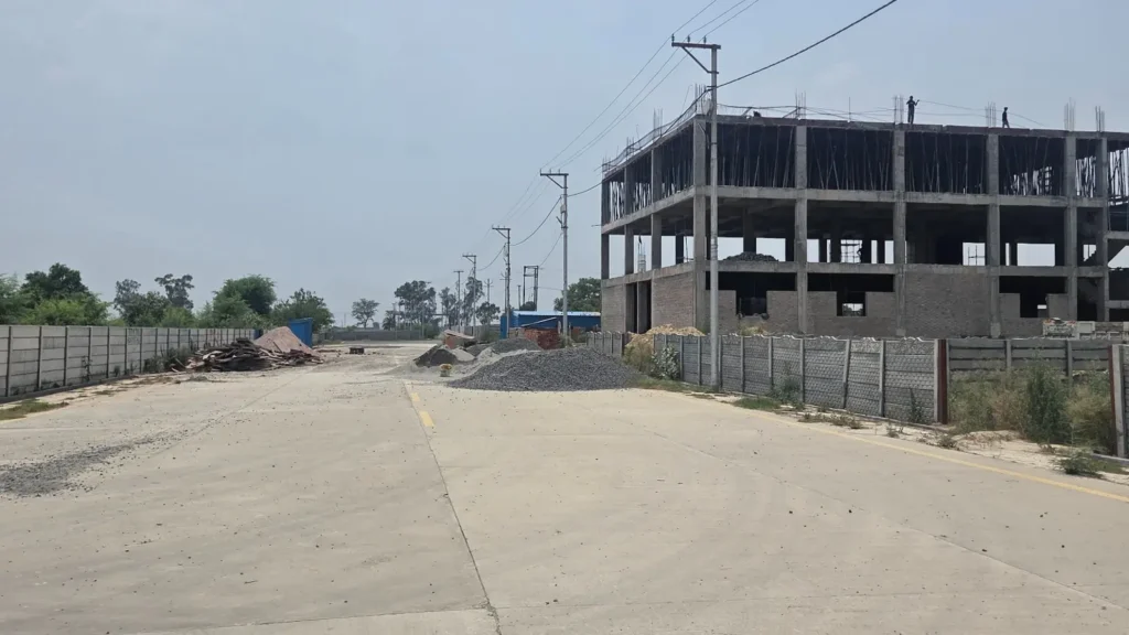 Industrial development zone in Baghpat with under-construction industrial infrastructure and wide roads