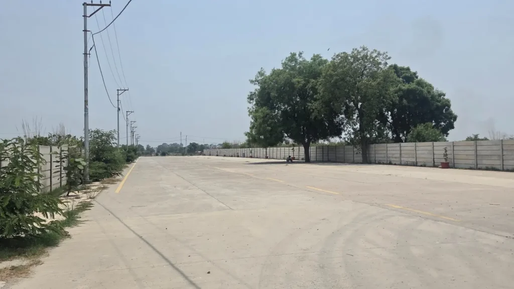 Industrial land in Baghpat with wide concrete road access and developed industrial corridor infrastructure