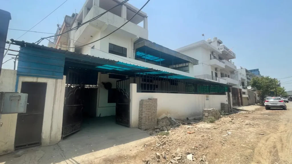 Industrial plot and land in Sahibabad Site 4 featuring existing built-up structure and road frontage