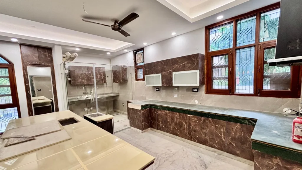 Modern modular kitchen in Residential Kothi in Noida Sector 56 with premium finishes and ample workspace.